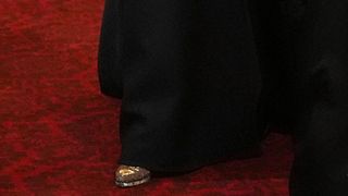 A close-up of Duchess Sophie's gold shoes at a State Banquet in December 2024