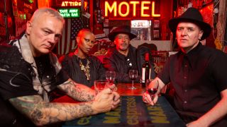 Skunk Anansie sitting at a table in a bar