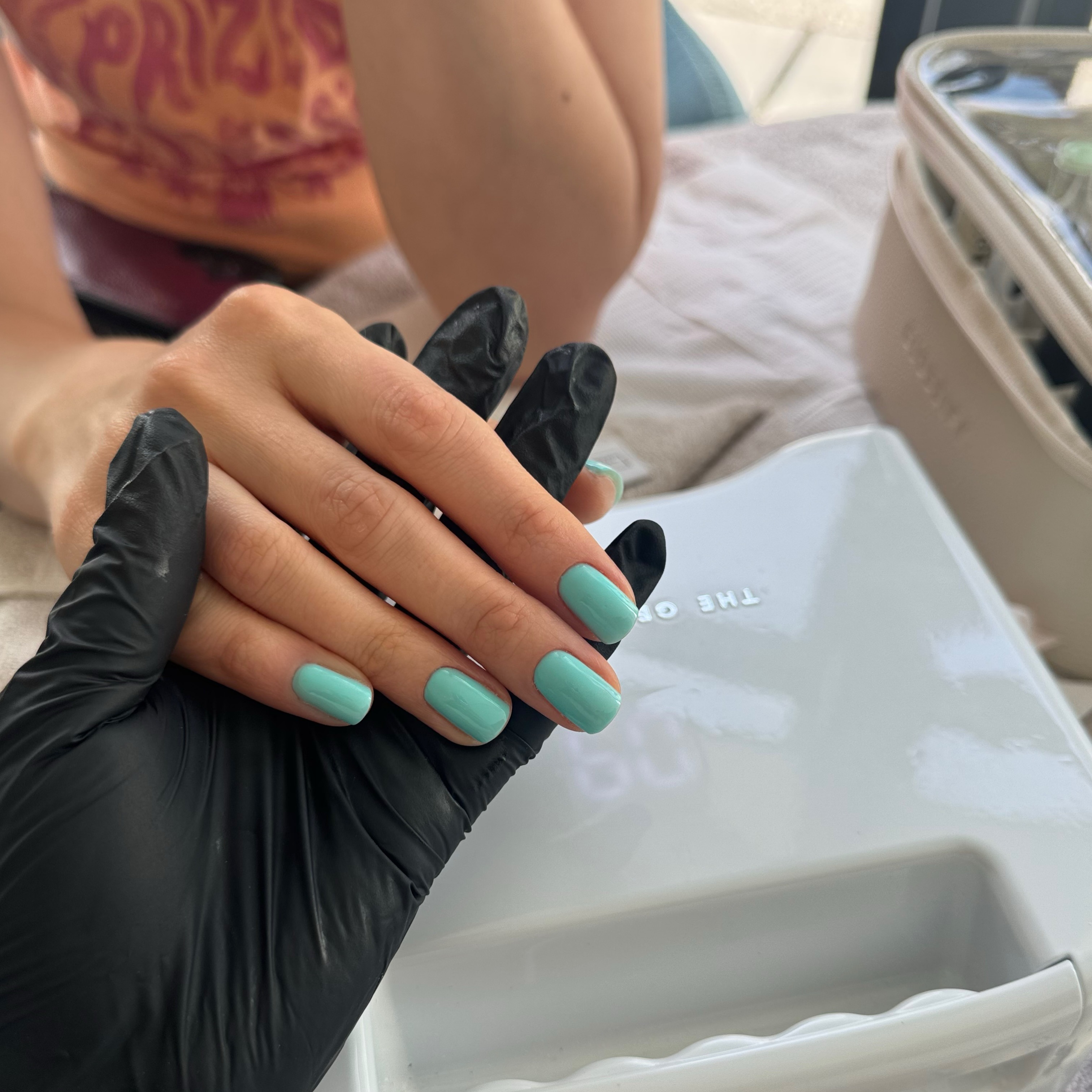 A bright turquoise manicure