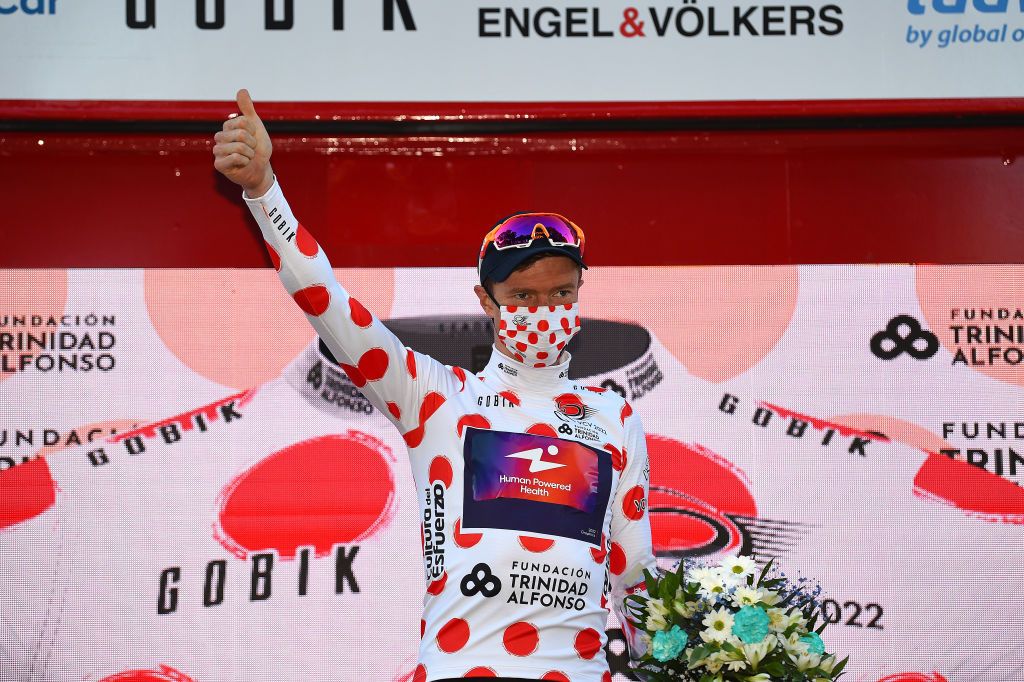 TORRENT SPAIN FEBRUARY 03 Benjamin King of United States and Team Human Powered Health Polka Dot Mountain Jersey celebrates at podium after the during the 73rd Volta A La Comunitat Valenciana 2022 Stage 2 a 1715km stage from Btera to Torrent VCV2022 on February 03 2022 in Torrent Spain Photo by Dario BelingheriGetty Images