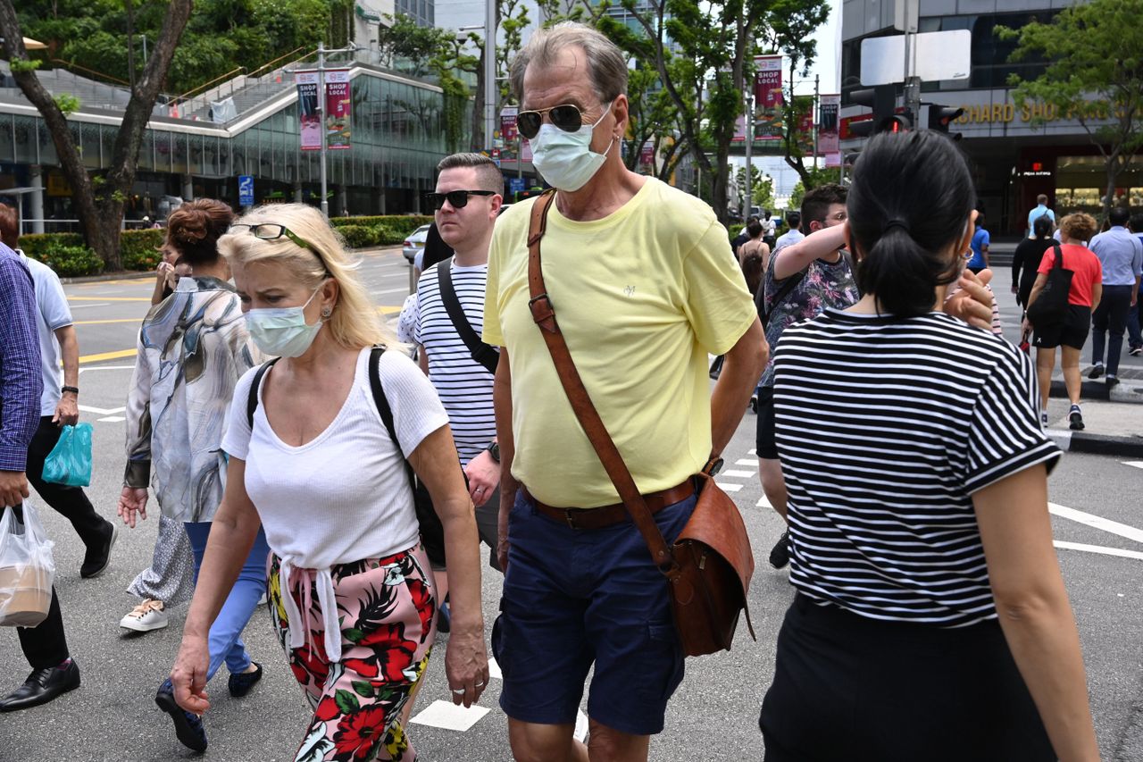 A couple in facemasks