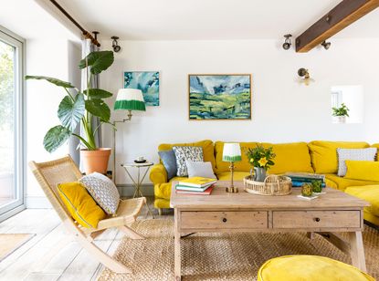 living room with yellow sofas and sliding glass doors