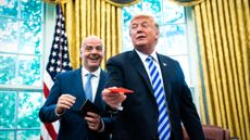 FIFA head Gianni Infantino hands red card to President Donald Trump in the Oval Office