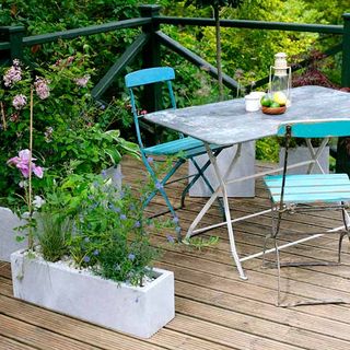 balcony garden with wooden floor and potted plants