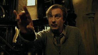 Lupin pointing at Harry.