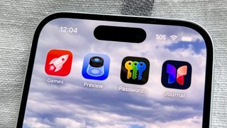 The Apple Games app in iOS 26 on an iPhone 15 screen