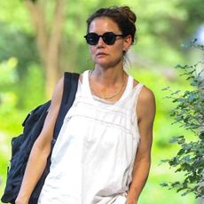 Katie Holmes wore khaki pants and a babydoll dress as a shirt in NYC