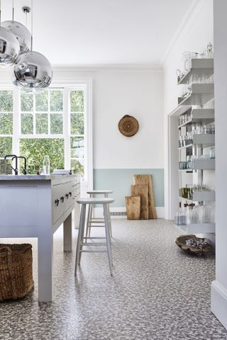 How to design a kitchen: light and airy kitchen with white and blue colour blocked walls, open shelving and textured flooring