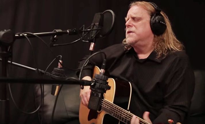 Warren Haynes plays acoustic guitar in a recording studio