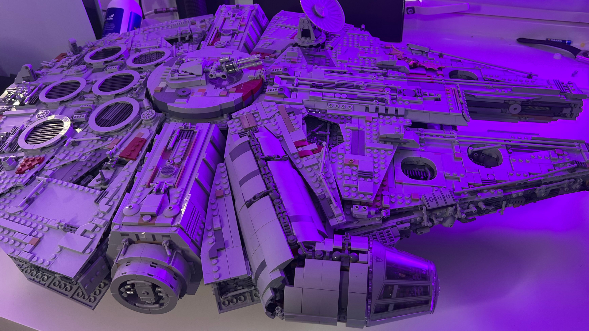 A side-view of the Lego UCS Millennium Falcon, sat on a table