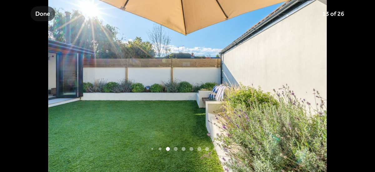 A back garden with astroturf