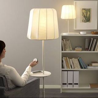 white room with lamp lights and cupboard