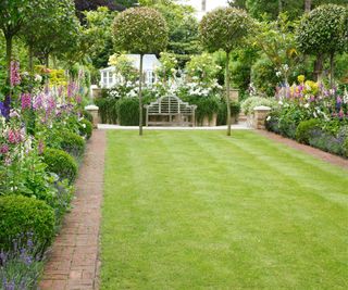 Real Garden Dulwich. Grass lawn. Flower beds.