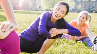 Group of women stretching in the park