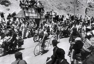 Eddy Merckx leads teammate Georges Vandenberghe across the Col du Tourmalet summit in the 1969 Tour.