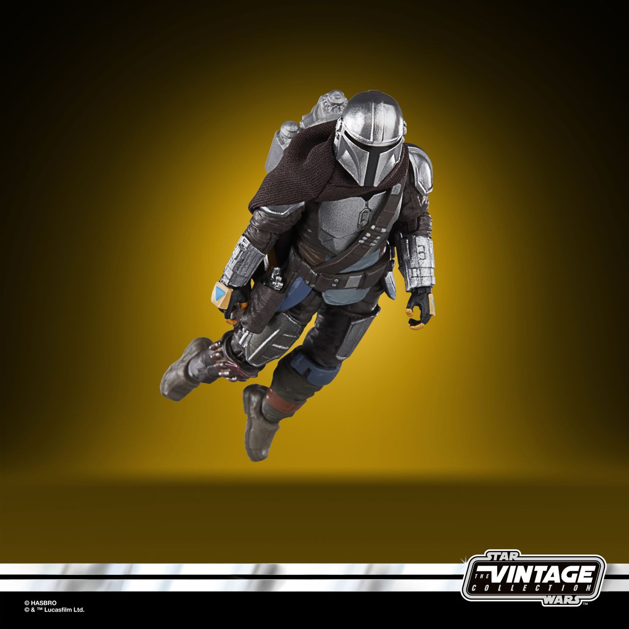 The Vintage Collection Mandalorian figure, posed on a yellow and black background