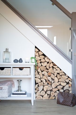 Hutchinson house: white staircase with cut-out section for log storage