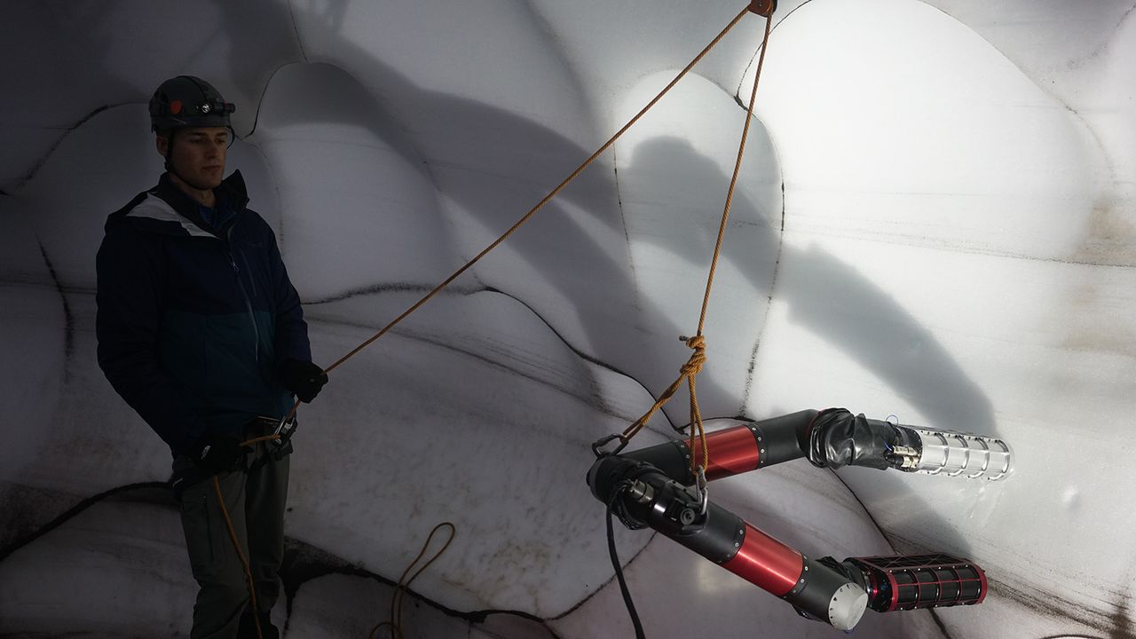 Ice Worm, a robot designed to explore on planets like Mars, climbs an icy wall like an inchworm.