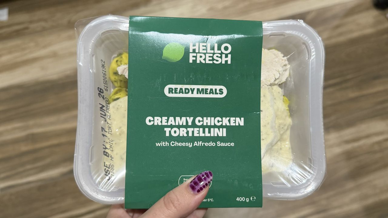 Hand holding Hellofresh meal