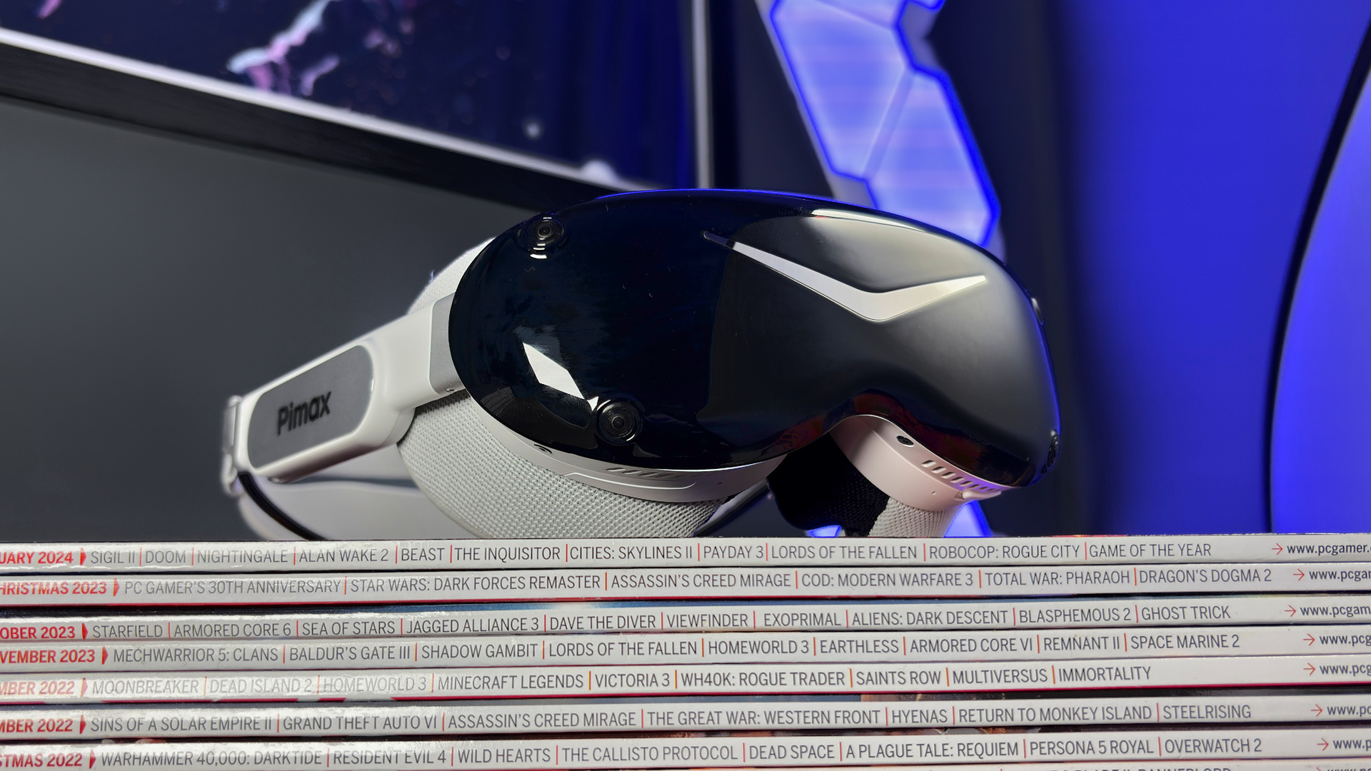 The Pimax Dream Air in white on a stack of PC Gamer magazine.