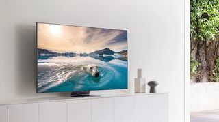 What is QLED? A QLED TV mounted on a wall