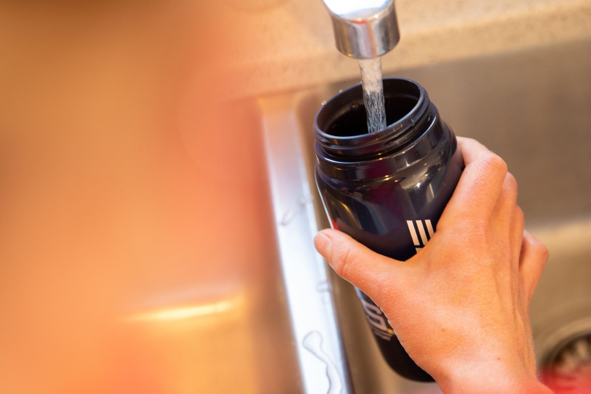 Image shows rider cycling in hot weather.