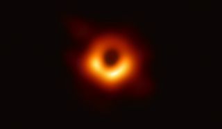 The Event Horizon Telescope captured this image of the supermassive black hole and its shadow that's in the center of the galaxy M87.