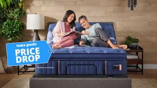 A woman and man lying down on Stearns&Foster Lux Estate mattress in a brightly lit room
