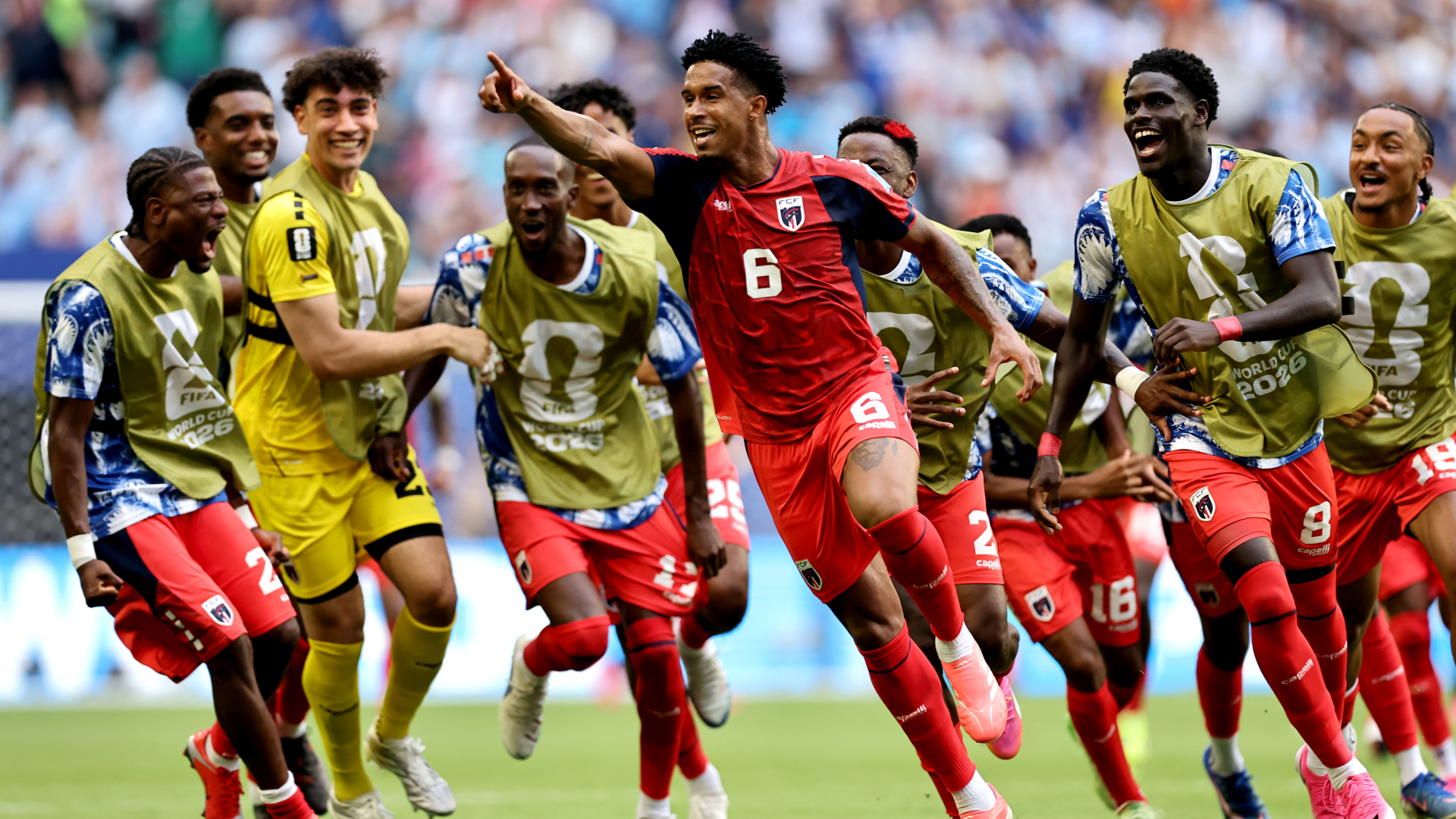  Kevin Pina #6 of Cabo Verde celebrates with teammates after scoring the team's first goal during the FIFA World Cup 2026 Group H match between Uruguay and Cabo Verde at Miami Stadium on June 21, 2026