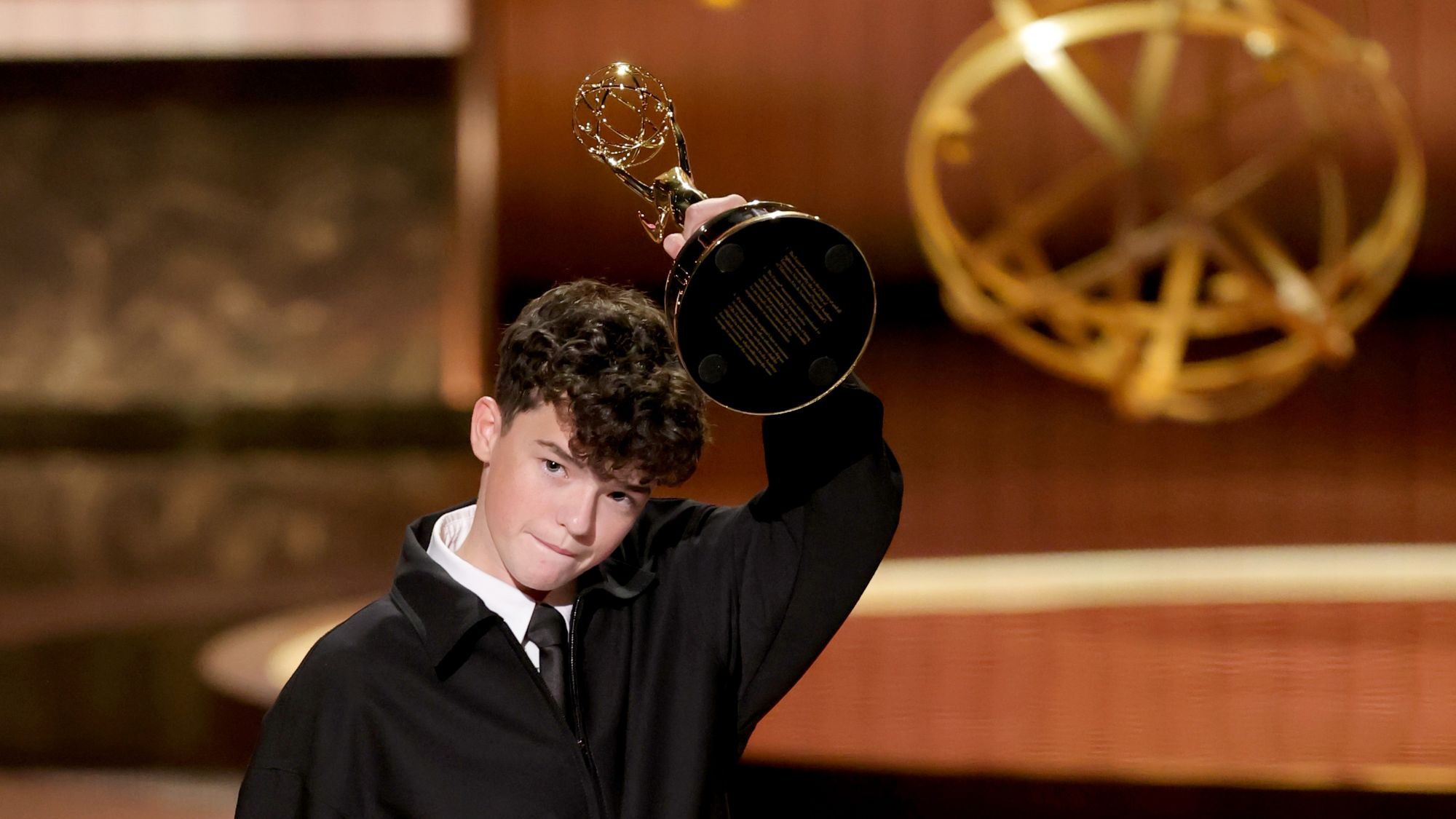 Owen Cooper celebrates his win at the 2025 Emmy Awards
