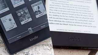 Closeup of Kindle logo on a Kindle eReader, split with a closeup of Kobo logo on a Kobo eReader