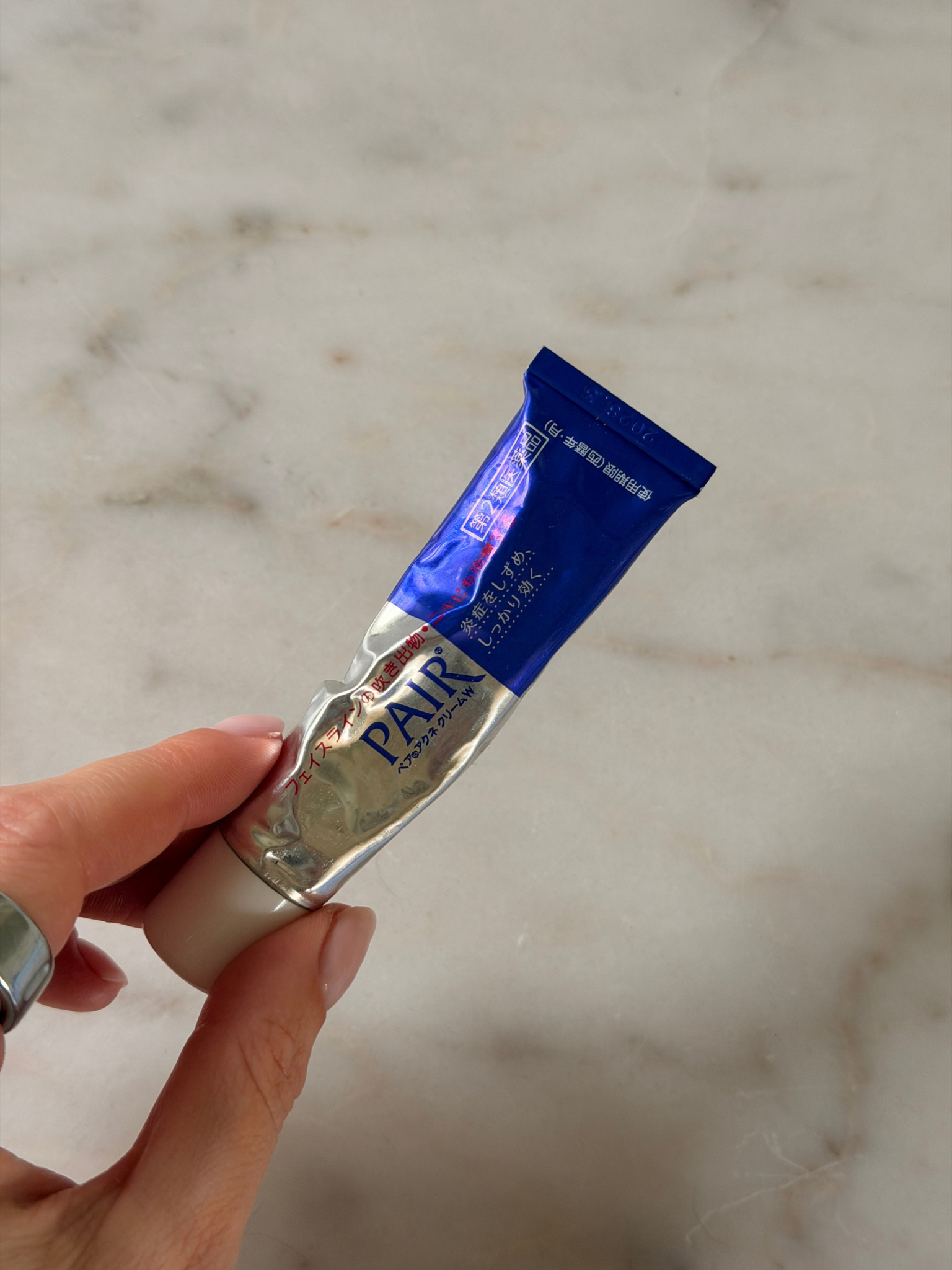 Freelance beauty editor Grace Day holding the Lion Pair Acne Cream