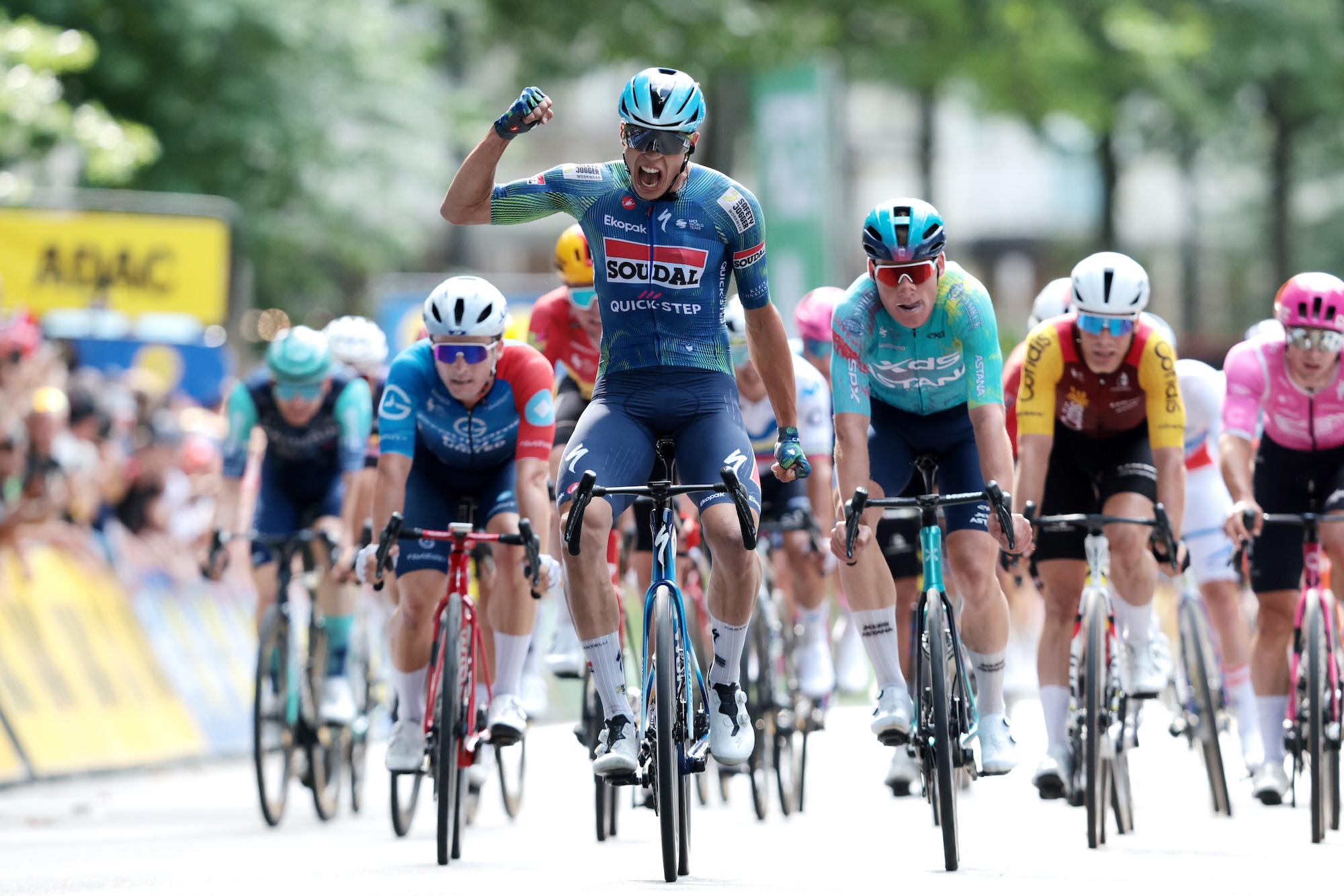 HAMBURG, GERMANY - AUGUST 16: (L-R) Paul Magnier of France and Team Soudal Quick-Step celebrates at finish line as race winner ahead of Mike Teunissen of Netherlands and Team XDS Astana Team during the 29th ADAC Cyclassics Hamburg 2026 a 205.3km one day race from Buxtehude to Hamburg / #UCIWT / on August 16, 2026 in Hamburg, Germany. (Photo by Ronny Hartmann/Getty Images)