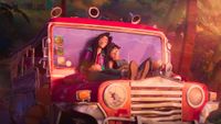 Raissa and Jo on a car in Forgotten Island.