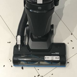 Hoover Upright 300 Pets Vacuum Cleaner being used on white tiled floor