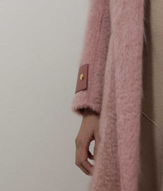 Pink fluffy jacket close up
