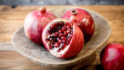close focus of pomegranate fruits on plate 