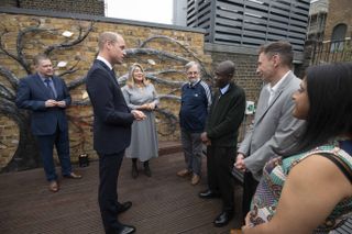 Prince William, Duke of Cambridge, Royal Patron of The Passage, speaks to people as he marks the 40th anniversary of the homelessness charity The Passage