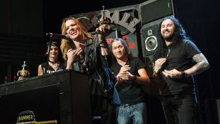 A shocked, elated Lzzy collects her award from Dragonforce