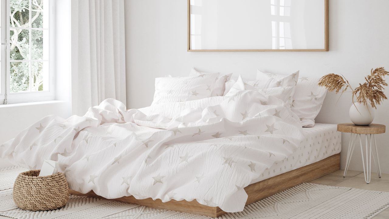 White bedroom with messy bed