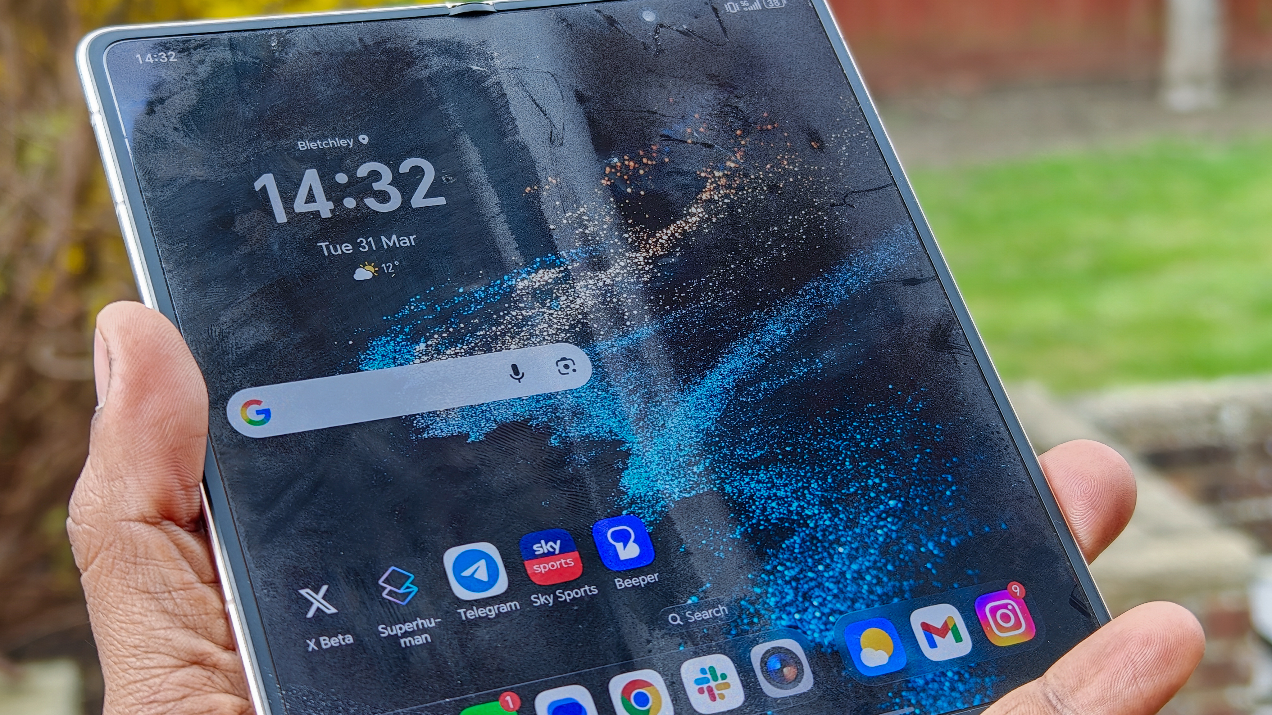 The Honor Magic V6 in gold after being put through a washing machine, complete with scratches and blemishes but fully working. 