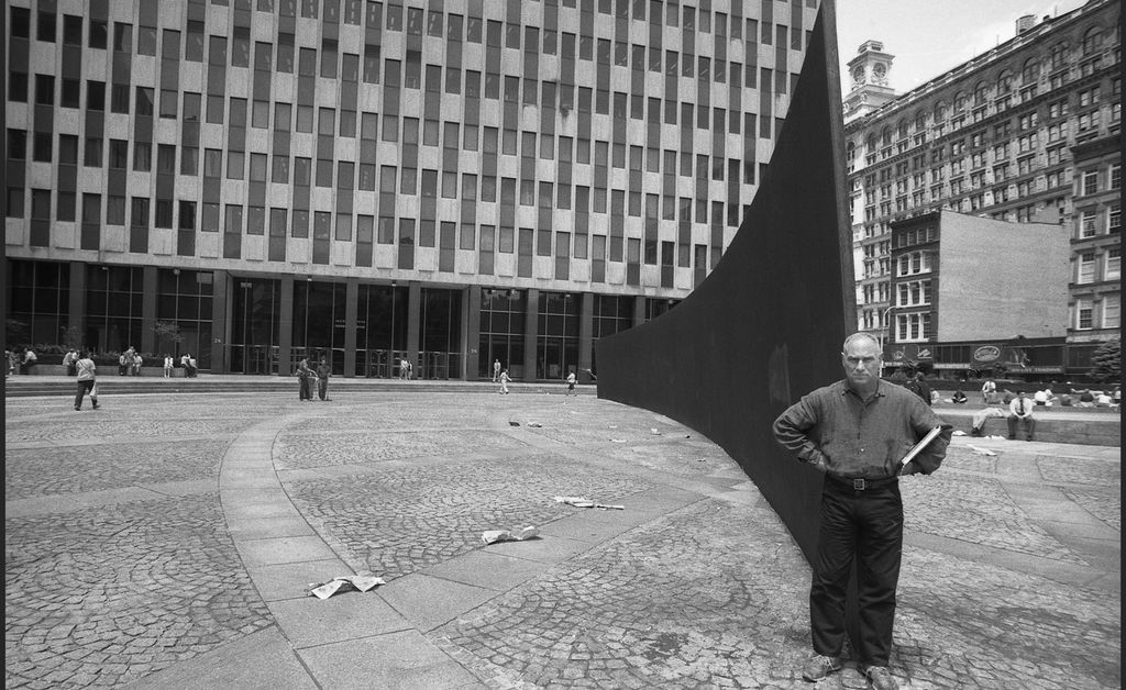 Man in front of a painting