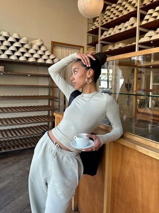 Amaka Hamelijnck wearing comfy basics from Adanola and a high bun.