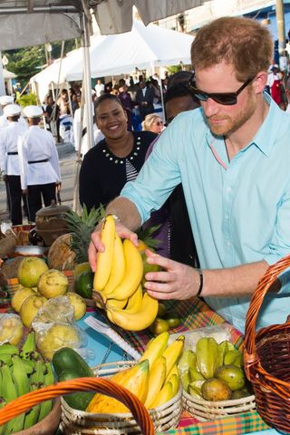 Prince Harry with a bunch of bananas