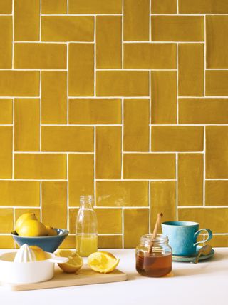 Yellow tile backsplash and white countertop