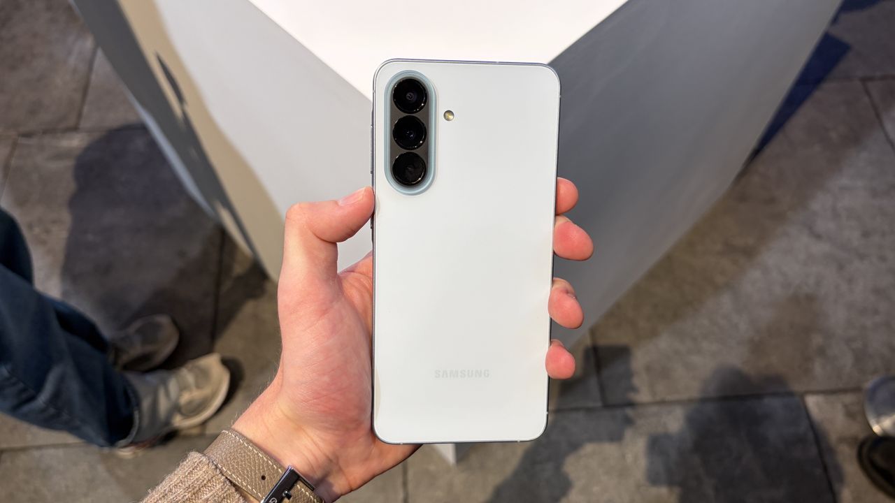 The Samsung Galaxy A57 being held in the hand