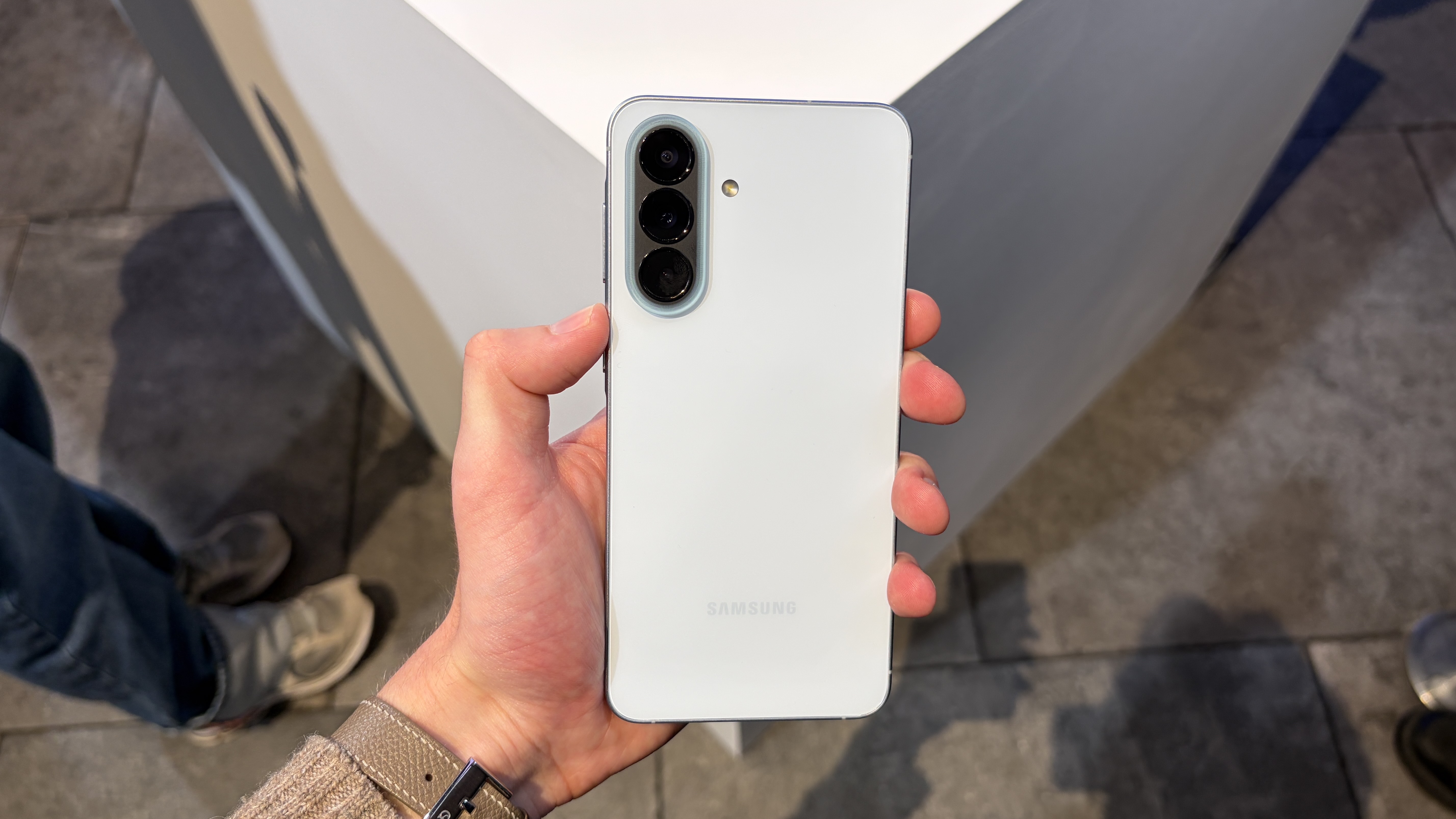 The Samsung Galaxy A57 being held in the hand