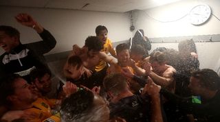 Maidstone United players celebrate after beating Stevenage to advance to the FA Cup fourth round in January 2024.