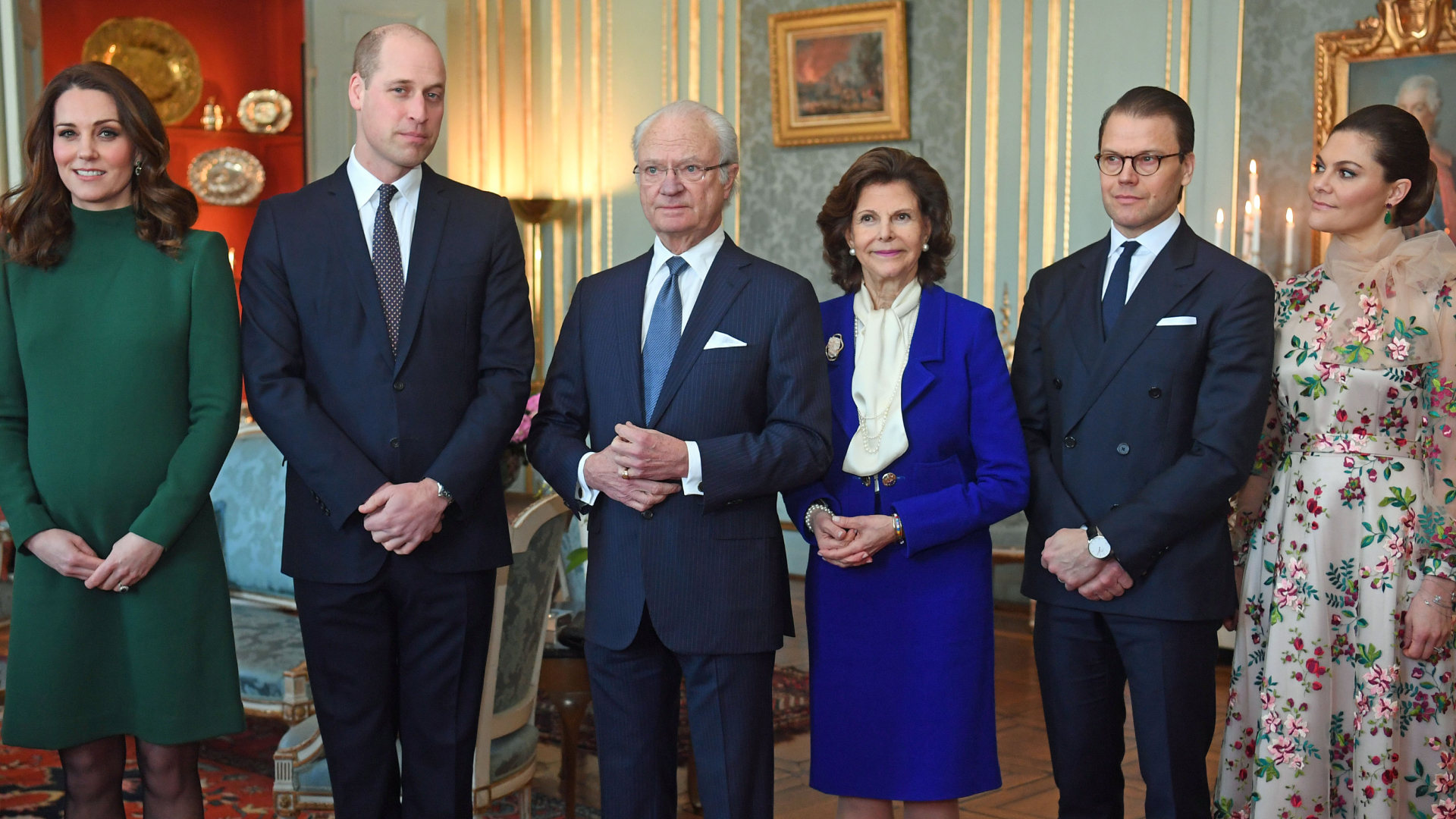 Kate Middleton wears a green dress and poses with husband Prince William and members of the Swedish Royal Family