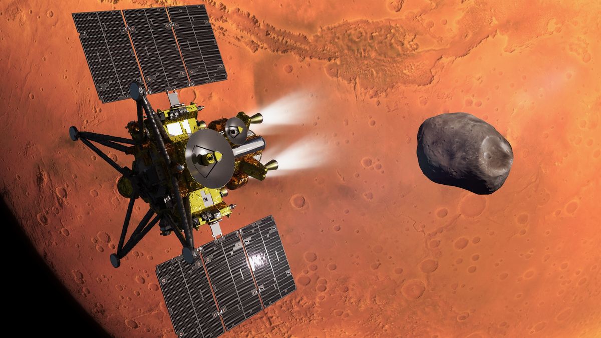 An artist’s concept of JAXA’s MMX spacecraft during its Mars’ orbit insertion. The Martian moon Phobos, which MMX will explore and sample, is in the background.